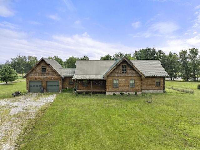 4210 S County Road 400 E, North Vernon, IN 47265 - log home featuring dirt driveway, a metal roof, and a garage