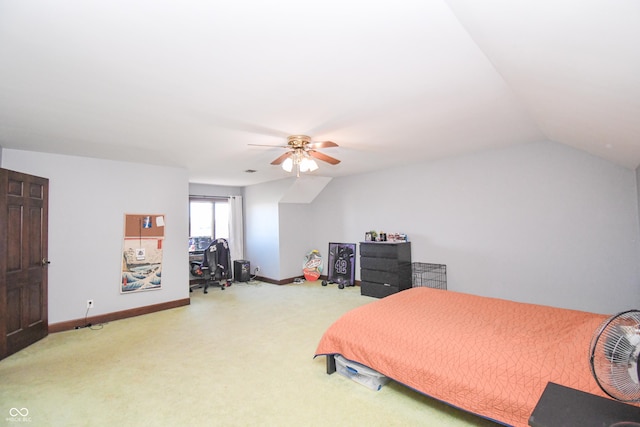 carpeted bedroom featuring ceiling fan and vaulted ceiling