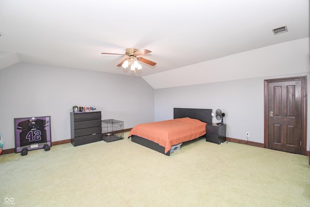 carpeted bedroom with ceiling fan and lofted ceiling