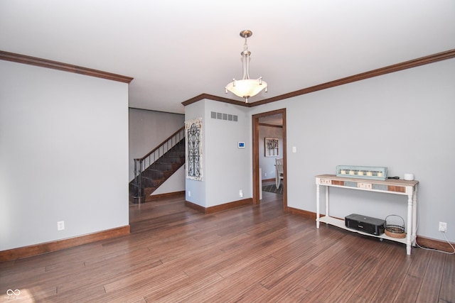 interior space featuring hardwood / wood-style floors and ornamental molding