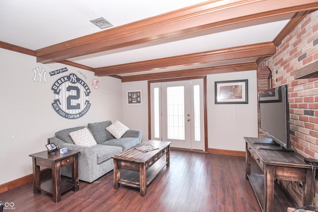 living room with beam ceiling and dark hardwood / wood-style flooring