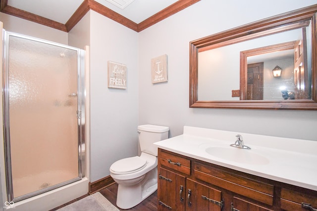 bathroom with an enclosed shower, ornamental molding, vanity, wood-type flooring, and toilet