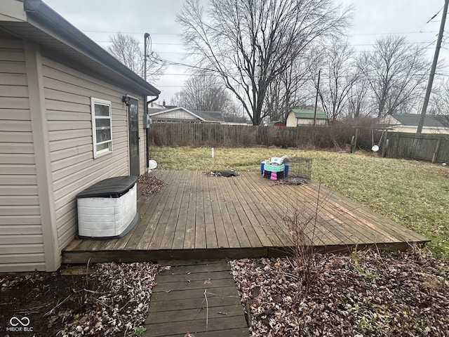 wooden deck with a lawn