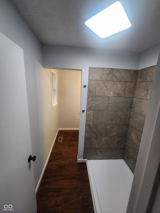 bathroom with hardwood / wood-style flooring