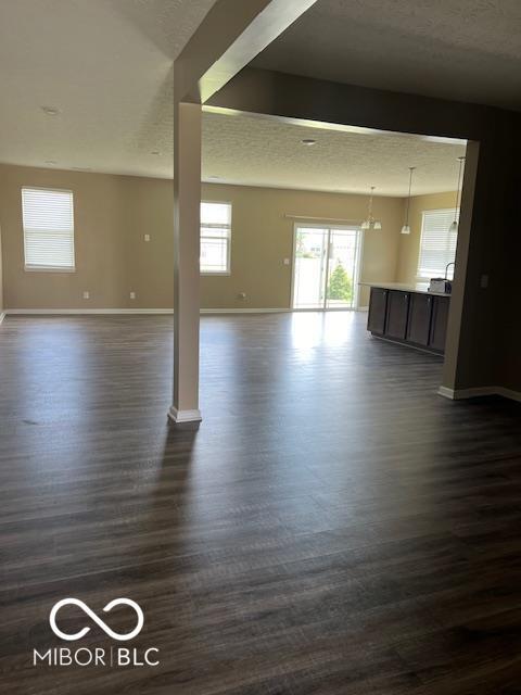 unfurnished room featuring dark wood-type flooring