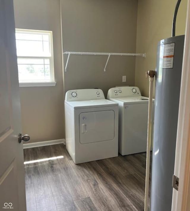 washroom featuring washer and dryer, wood-type flooring, and gas water heater