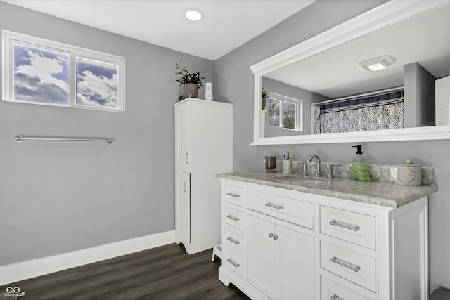 bathroom featuring vanity and hardwood / wood-style flooring