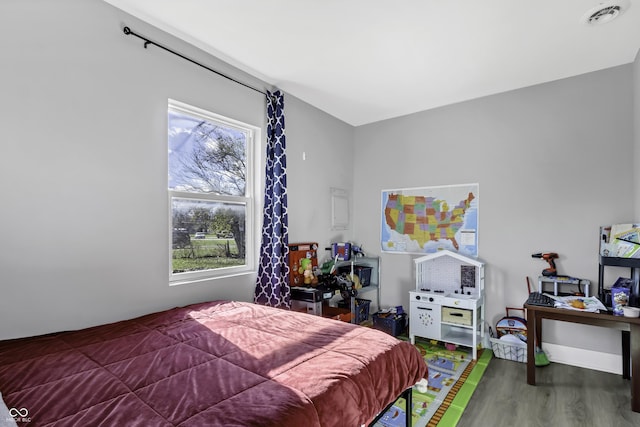 bedroom with wood-type flooring