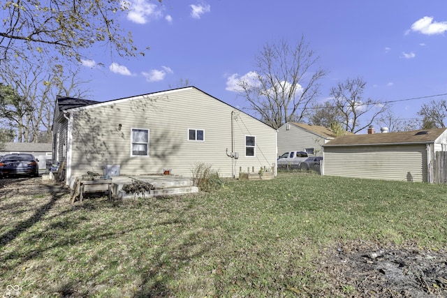 rear view of house featuring a lawn