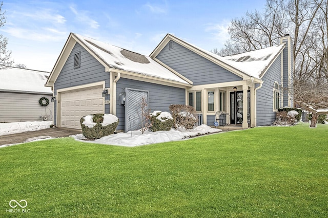 view of front of property featuring a garage and a front yard