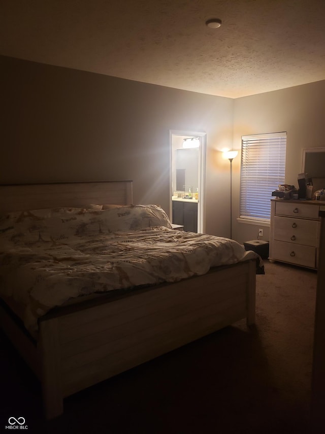 carpeted bedroom with ensuite bathroom