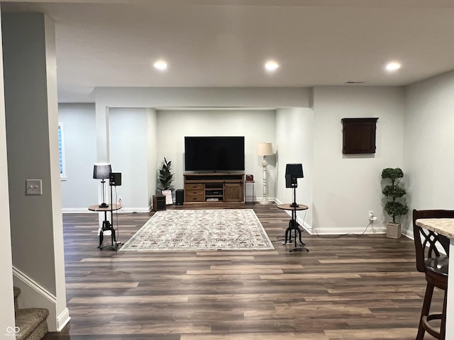 living room featuring dark wood-type flooring