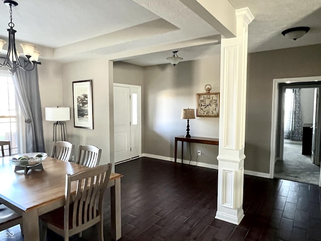 dining room featuring a notable chandelier, a raised ceiling, and dark wood-type flooring