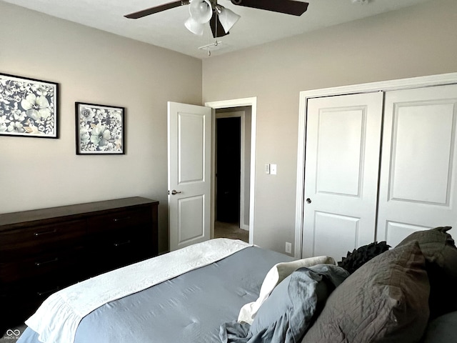 bedroom with ceiling fan and a closet