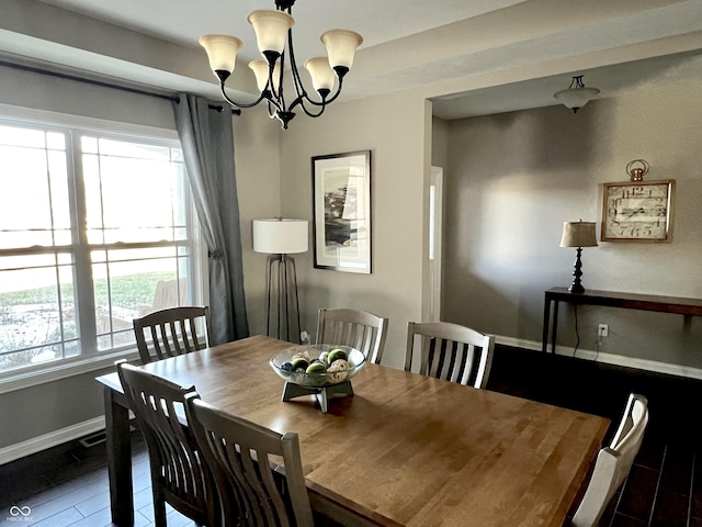 dining space with a notable chandelier