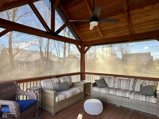 wooden terrace featuring outdoor lounge area and ceiling fan