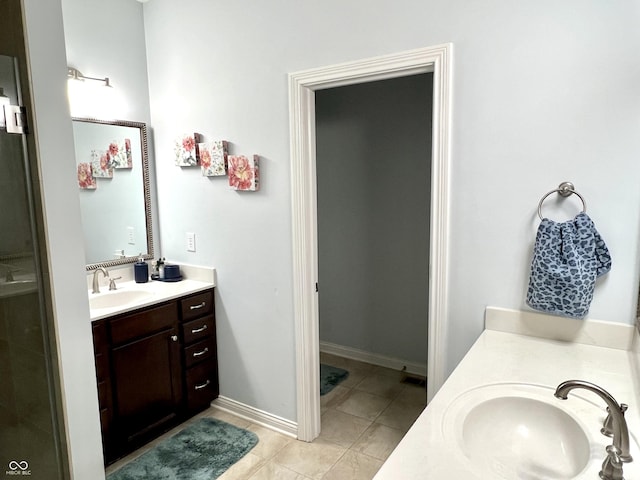 bathroom featuring tile patterned floors and vanity