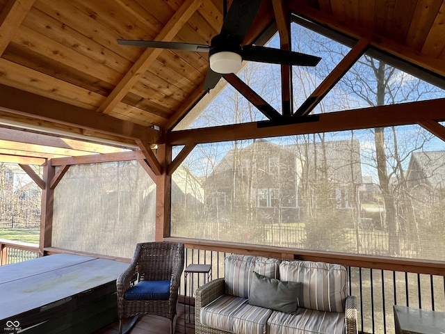 wooden deck featuring ceiling fan