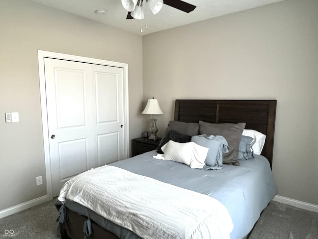 bedroom featuring dark colored carpet, a closet, and ceiling fan