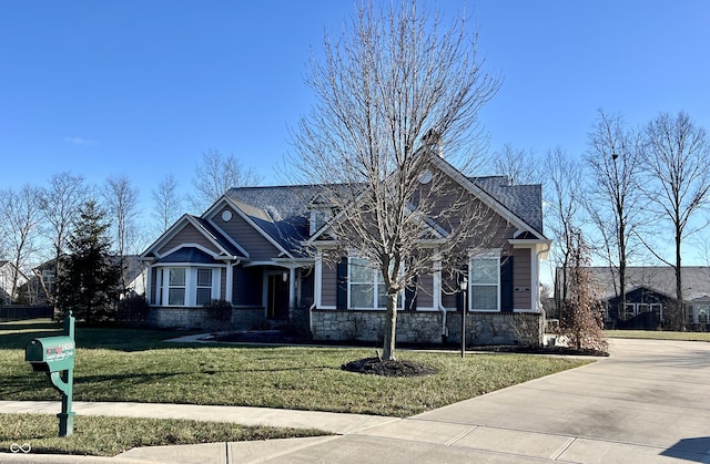 craftsman-style home with a front yard