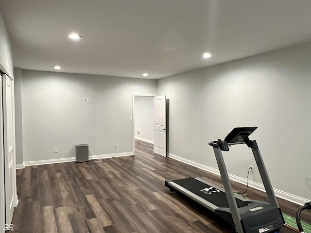 workout area with dark hardwood / wood-style floors