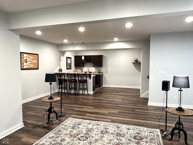 interior space featuring dark brown cabinetry and dark wood-type flooring