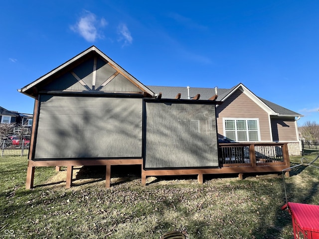 back of house featuring a deck