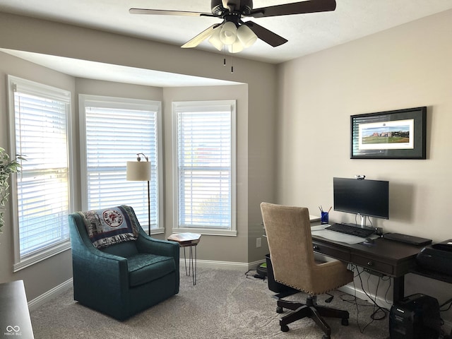 carpeted home office featuring a wealth of natural light and ceiling fan