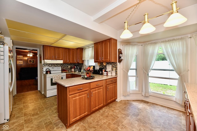 kitchen with ceiling fan, sink, hanging light fixtures, tasteful backsplash, and white appliances