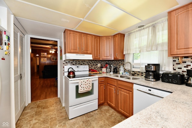 kitchen featuring white appliances, tasteful backsplash, ceiling fan, and sink