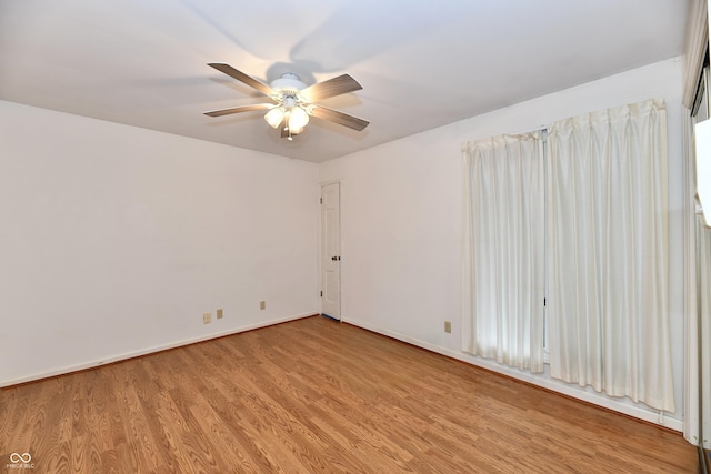 unfurnished room featuring light hardwood / wood-style flooring and ceiling fan