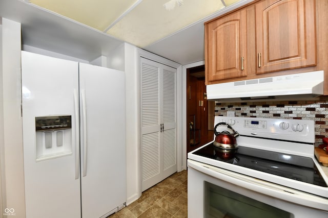 kitchen featuring decorative backsplash, light brown cabinetry, and white appliances