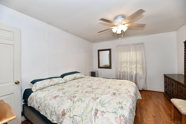 bedroom with radiator, ceiling fan, and hardwood / wood-style flooring