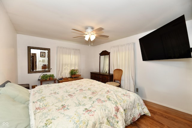 bedroom featuring ceiling fan and wood-type flooring