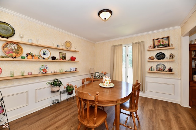 dining space featuring dark hardwood / wood-style floors and crown molding