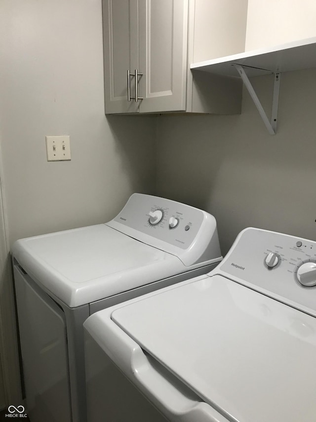 laundry area featuring cabinets and independent washer and dryer