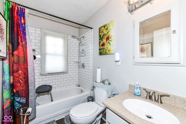 full bathroom featuring vanity, toilet, a textured ceiling, and shower / tub combo