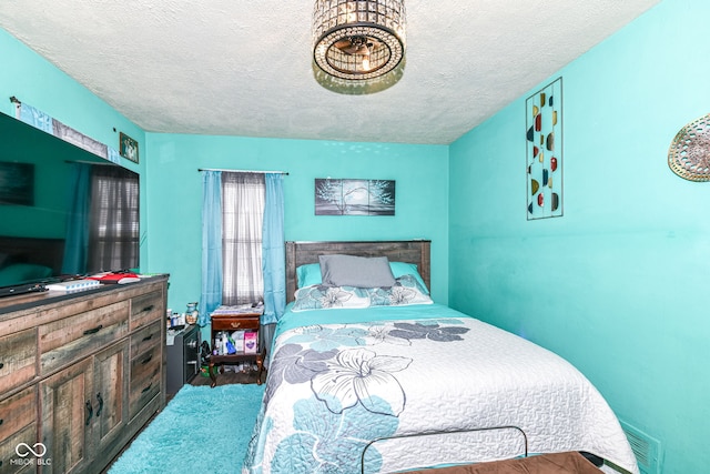 bedroom featuring a textured ceiling