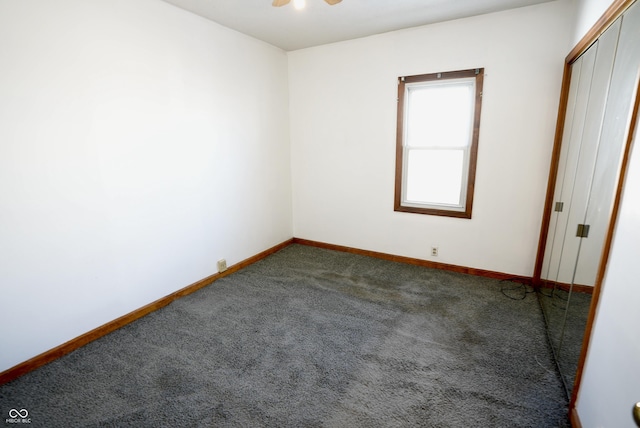 carpeted empty room with ceiling fan