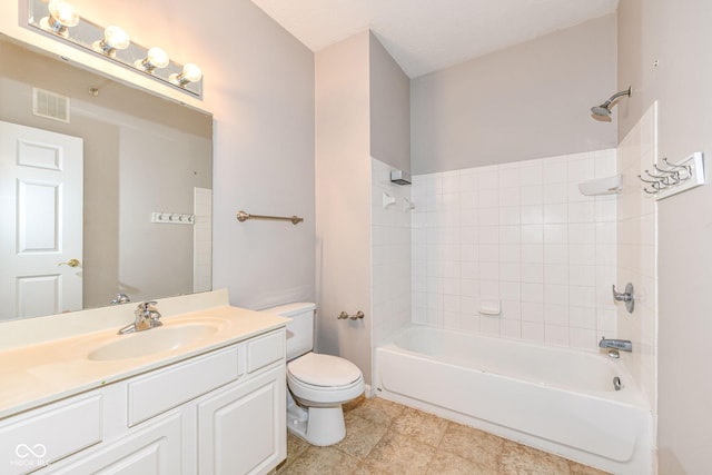 full bathroom featuring vanity, toilet, and tiled shower / bath combo