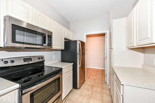 kitchen featuring white cabinets and stainless steel appliances