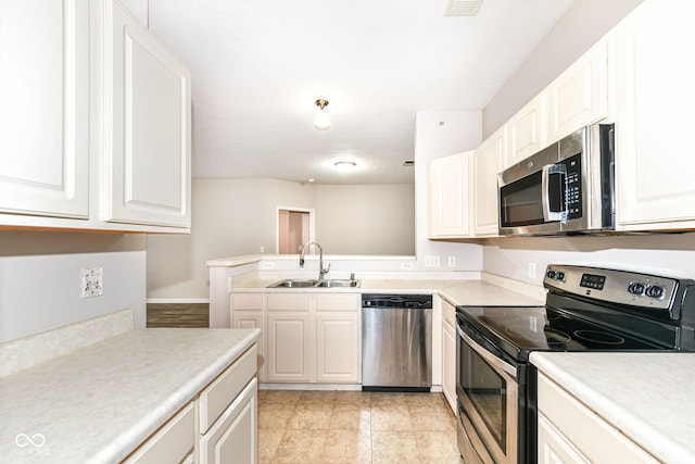 kitchen featuring sink, white cabinetry, and stainless steel appliances