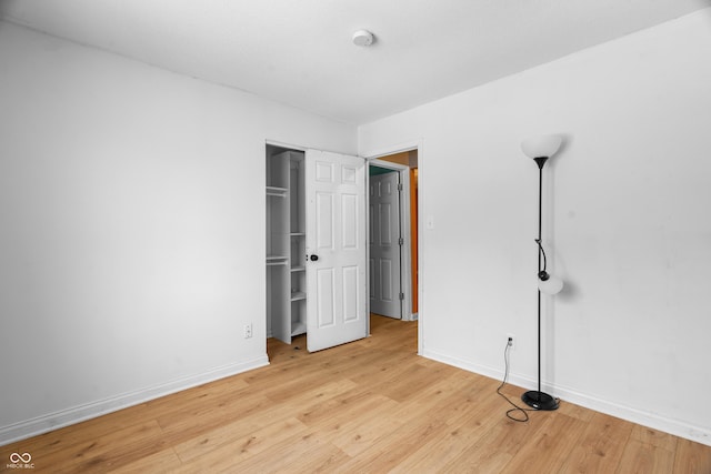 unfurnished bedroom with light wood-type flooring