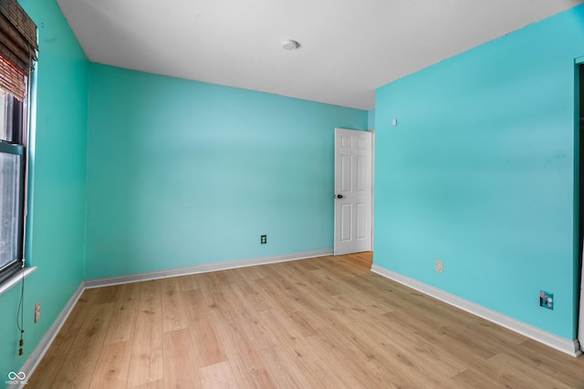 unfurnished room featuring light hardwood / wood-style floors