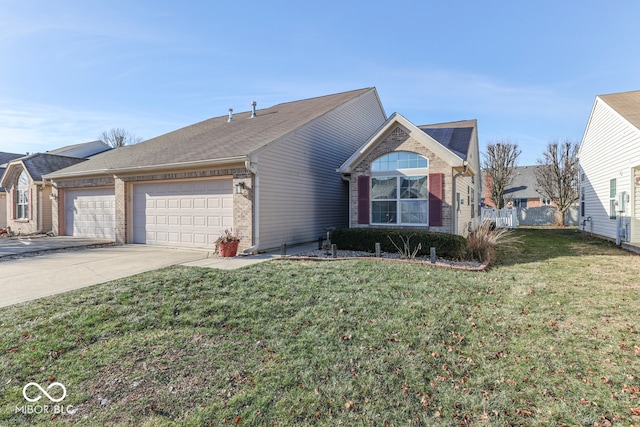 view of front facade with a garage and a front lawn