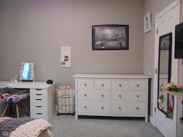 bedroom featuring light colored carpet