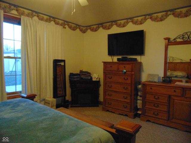 carpeted bedroom with ceiling fan