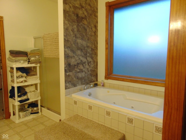 bathroom with tiled bath