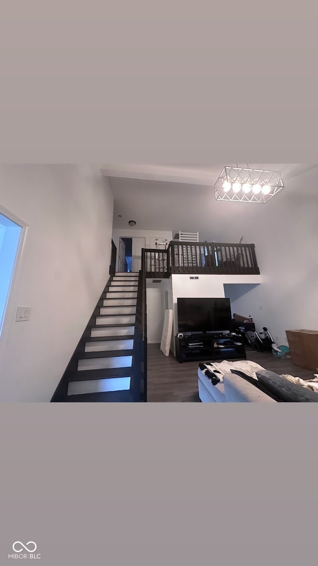 stairs featuring hardwood / wood-style flooring