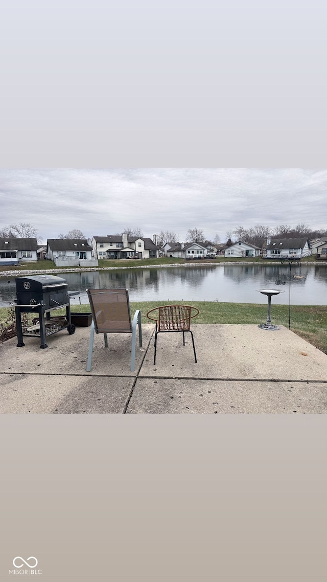 view of patio with a water view